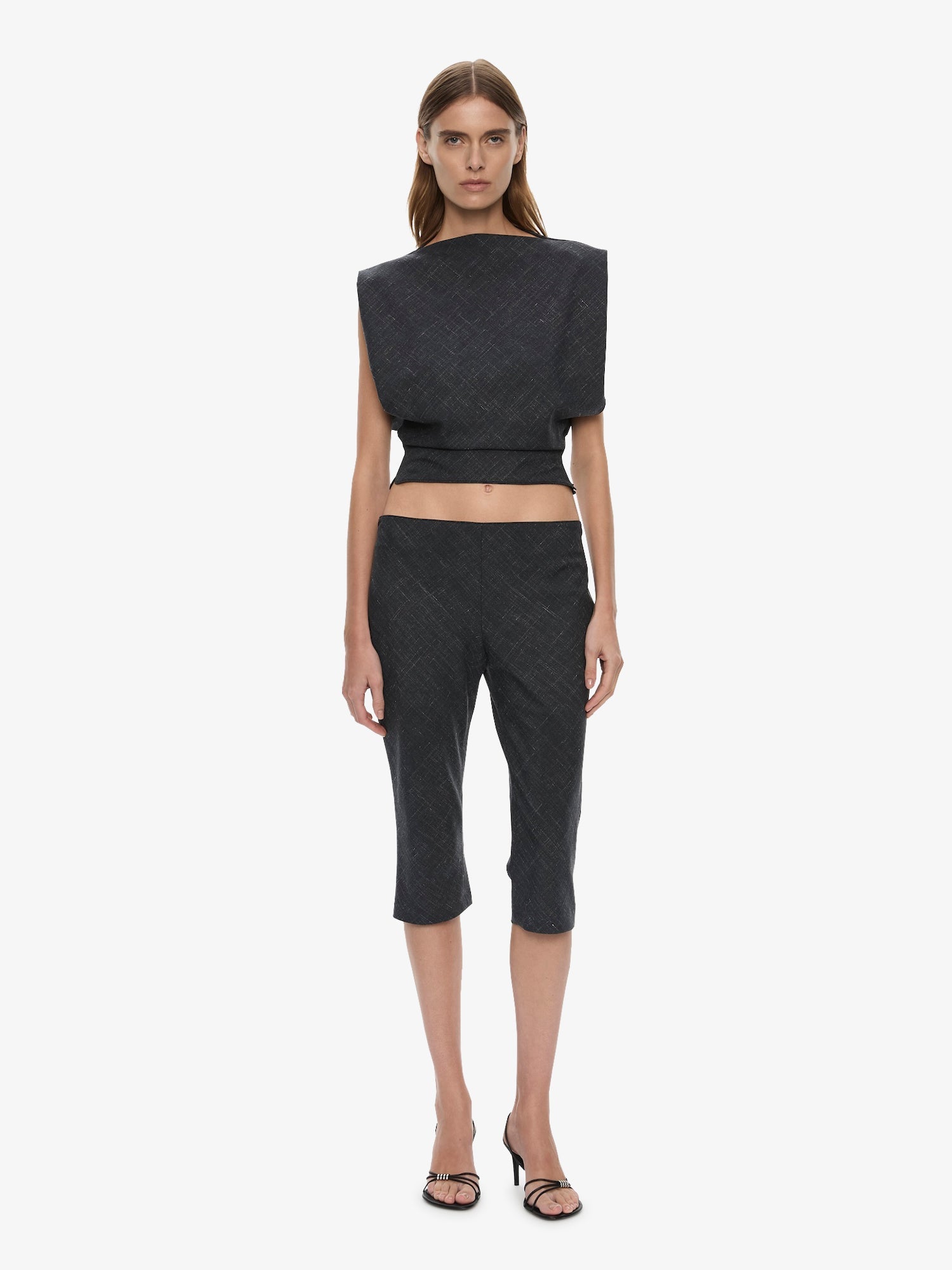 Image of a model wearing Shorts. Product name - Banyan Capri Pant in Marle colour by brand - CHRISTOPHER ESBER
