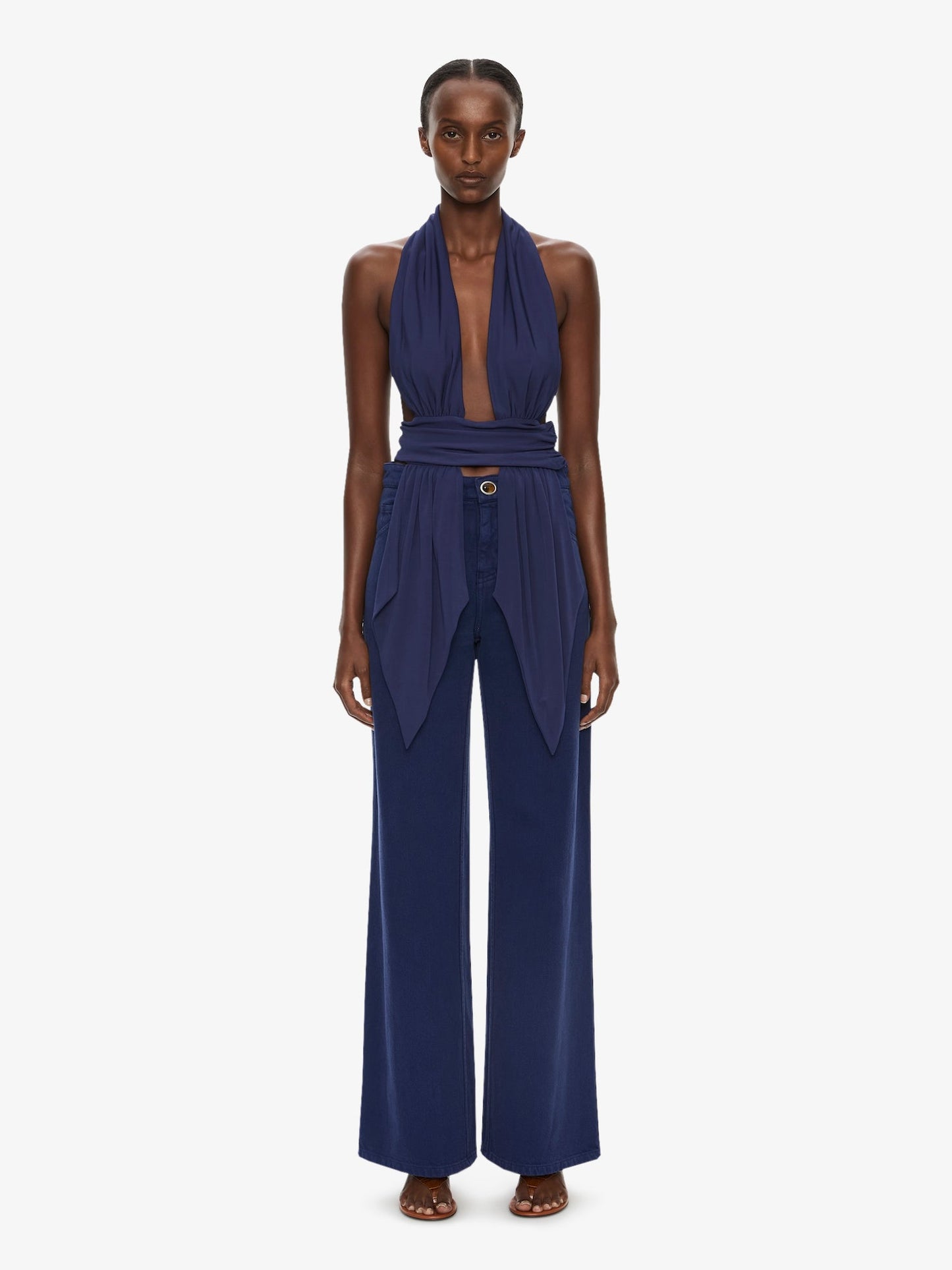 Image of a model wearing Pants. Product name - Relaxed Denim Quartz Jean in Ink colour by brand - CHRISTOPHER ESBER