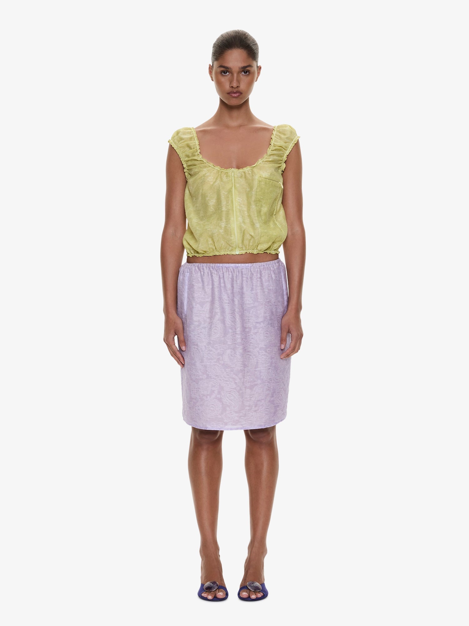 Image of a model wearing Skirts. Product name - Light Leak Jacquard Slip Skirt in Lilac colour by brand - CHRISTOPHER ESBER