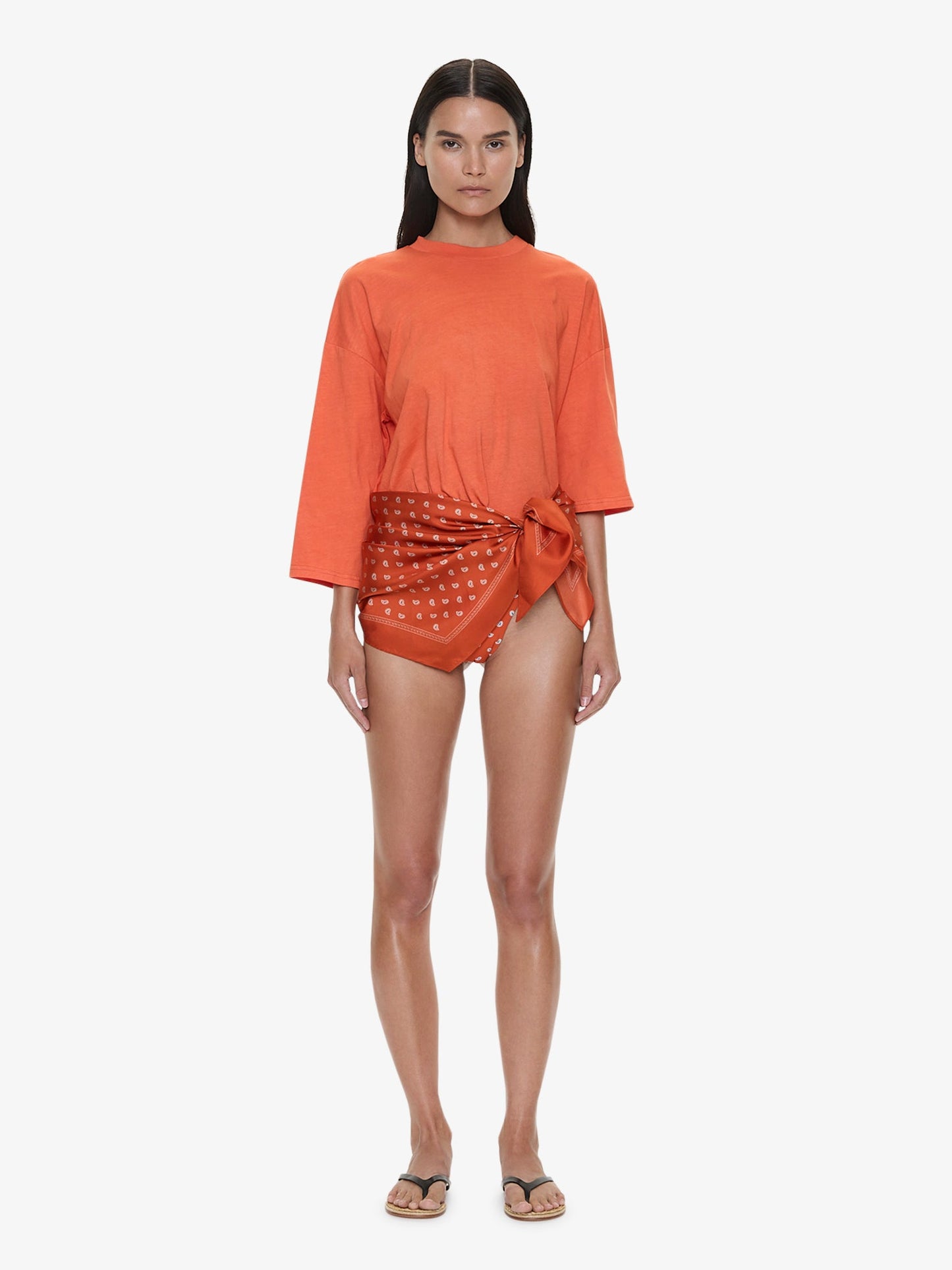Image of a model wearing Tops. Product name - Bandana Scarf Pareo Tee in Carnelian colour by brand - CHRISTOPHER ESBER