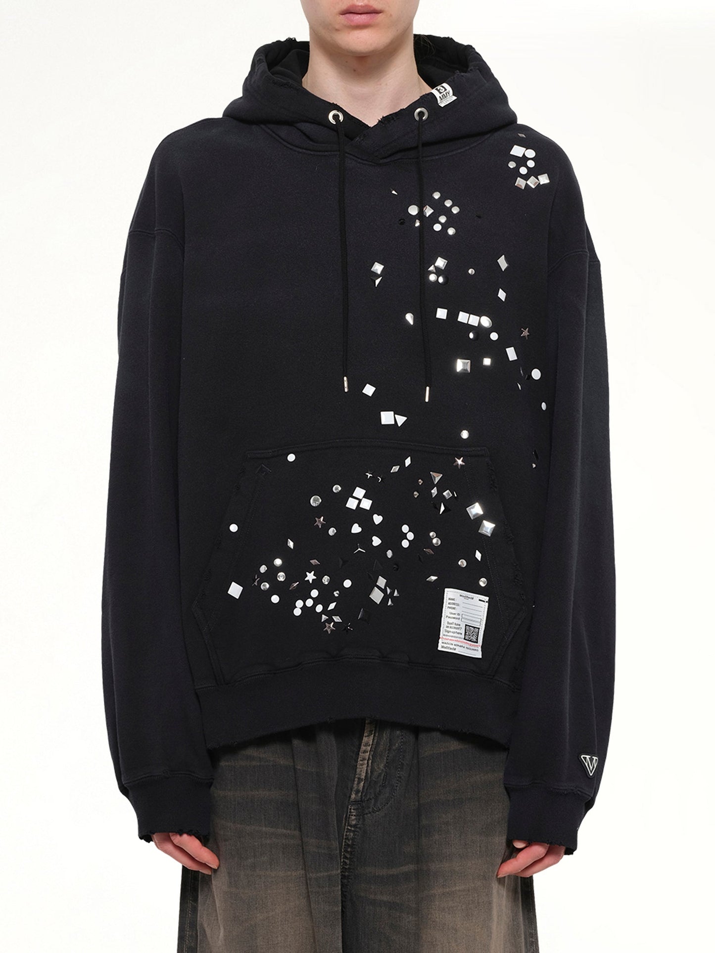 Image of a model wearing Outerwear. Product name - Embellished Hoodie in Black colour by brand - MAISON MIHARA YASUHIRO
