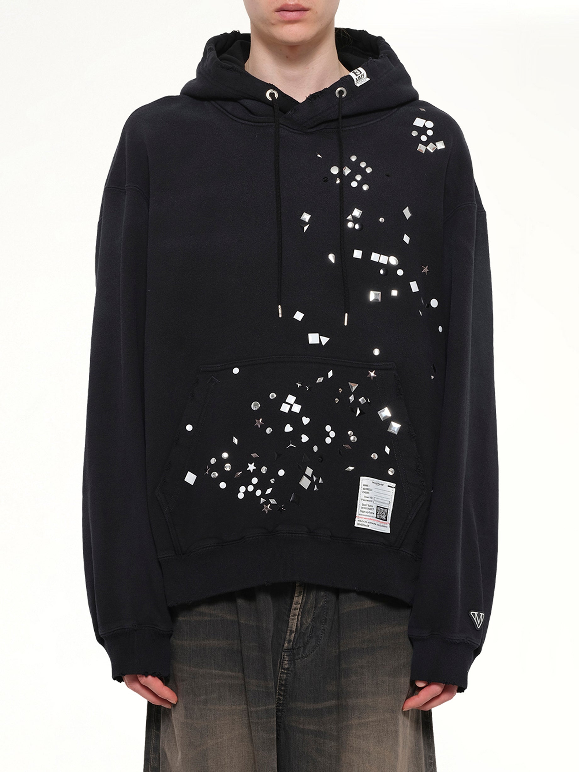 Image of a model wearing Outerwear. Product name - Embellished Hoodie in Black colour by brand - MAISON MIHARA YASUHIRO