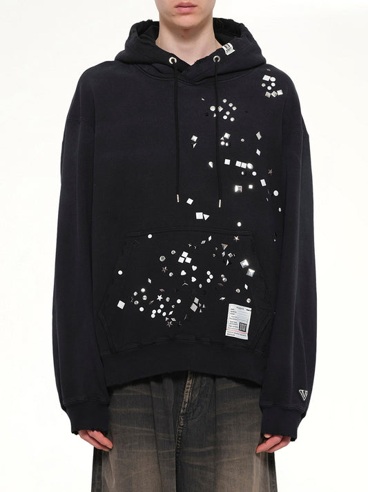Image of a model wearing Outerwear. Product name - Embellished Hoodie in Black colour by brand - MAISON MIHARA YASUHIRO