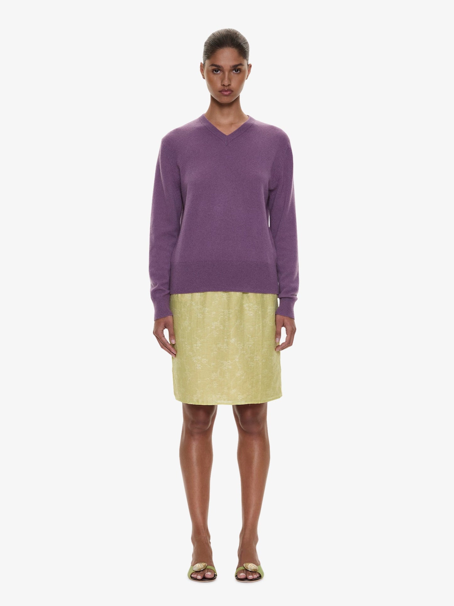 Image of a model wearing Skirts. Product name - Light Leak Jacquard Slip Skirt in Chartreuse colour by brand - CHRISTOPHER ESBER