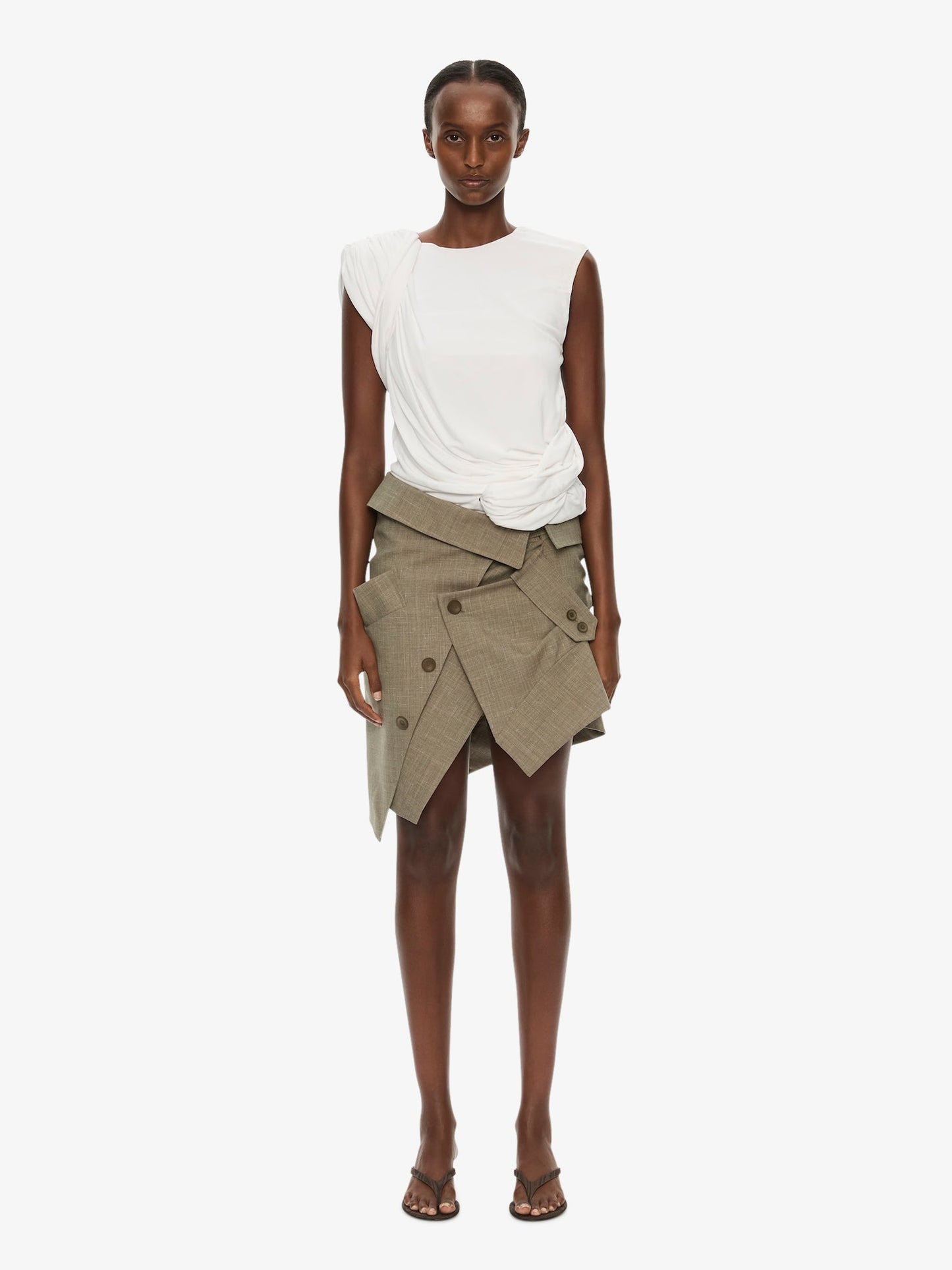 Image of a model wearing Skirts. Product name - Banyan Deconstructed Trench Skirt in Marle colour by brand - CHRISTOPHER ESBER