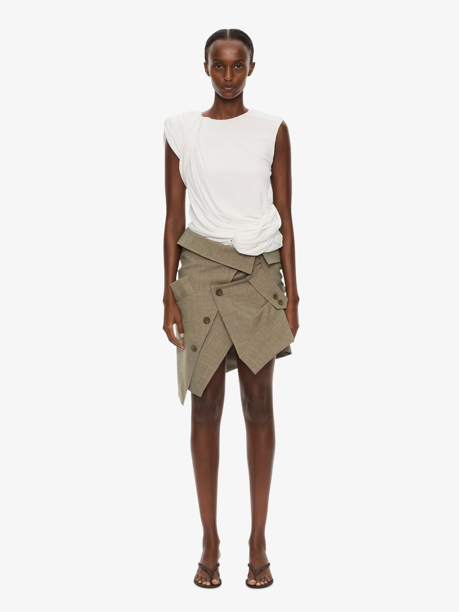 Image of a model wearing Skirts. Product name - Banyan Deconstructed Trench Skirt in Marle colour by brand - CHRISTOPHER ESBER
