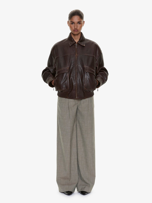 Image of a model wearing Pants. Product name - Tropical Wool Leather Waisted Trouser in Kombu colour by brand - CHRISTOPHER ESBER