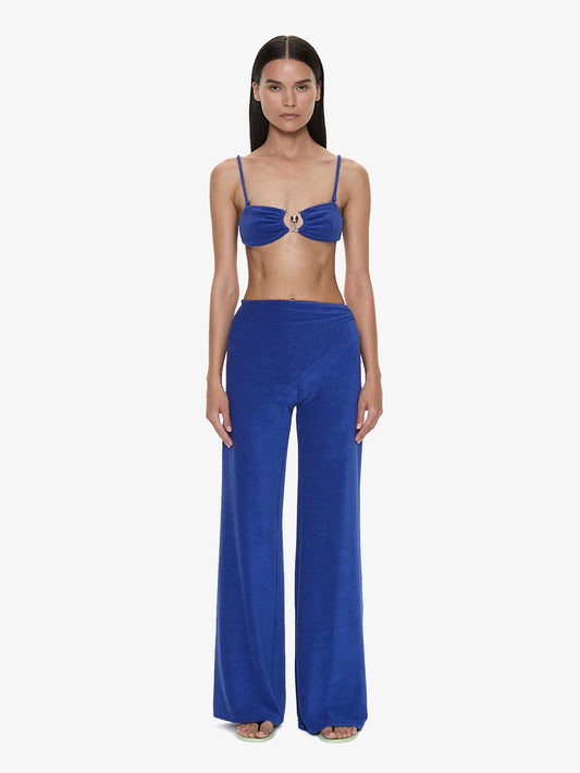Image of a model wearing Pants. Product name - Looped Back Orbit Pant in Indigo colour by brand - CHRISTOPHER ESBER