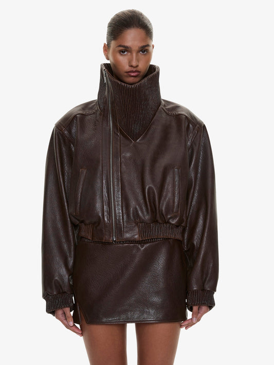 Image of a model wearing Outerwear. Product name - Lunnet Leather Bomber in Brown colour by brand - CHRISTOPHER ESBER