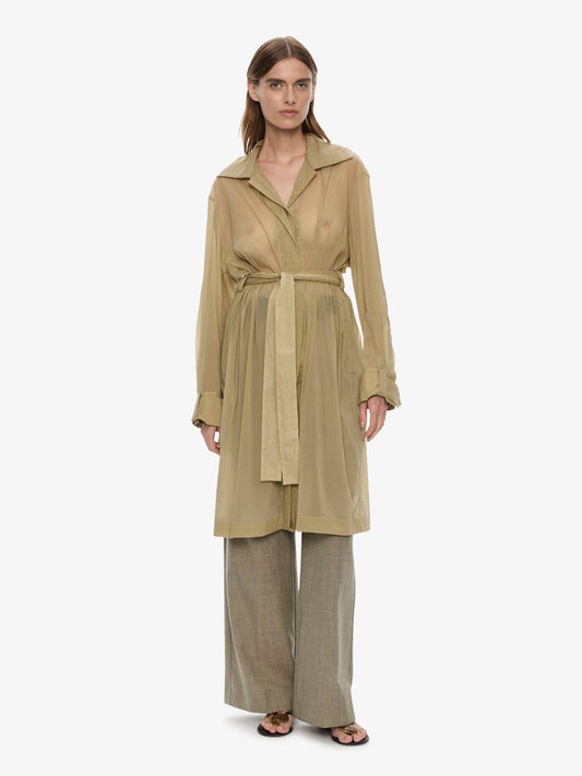 Image of a model wearing Outerwear. Product name - Lucent Mottled Sheer Chore Jacket in Moss colour by brand - CHRISTOPHER ESBER