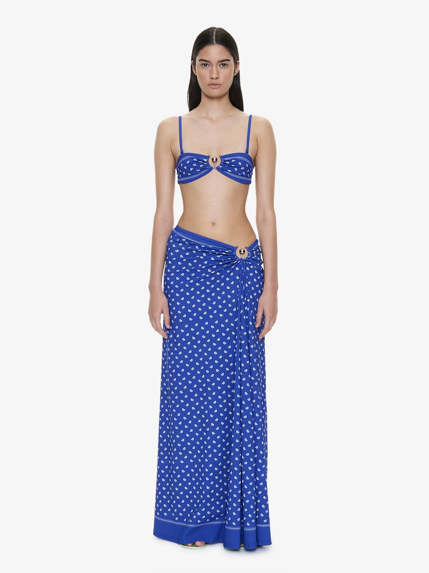 Image of a model wearing Skirts. Product name - Bandana Ruched Orbit Skirt in Print colour by brand - CHRISTOPHER ESBER