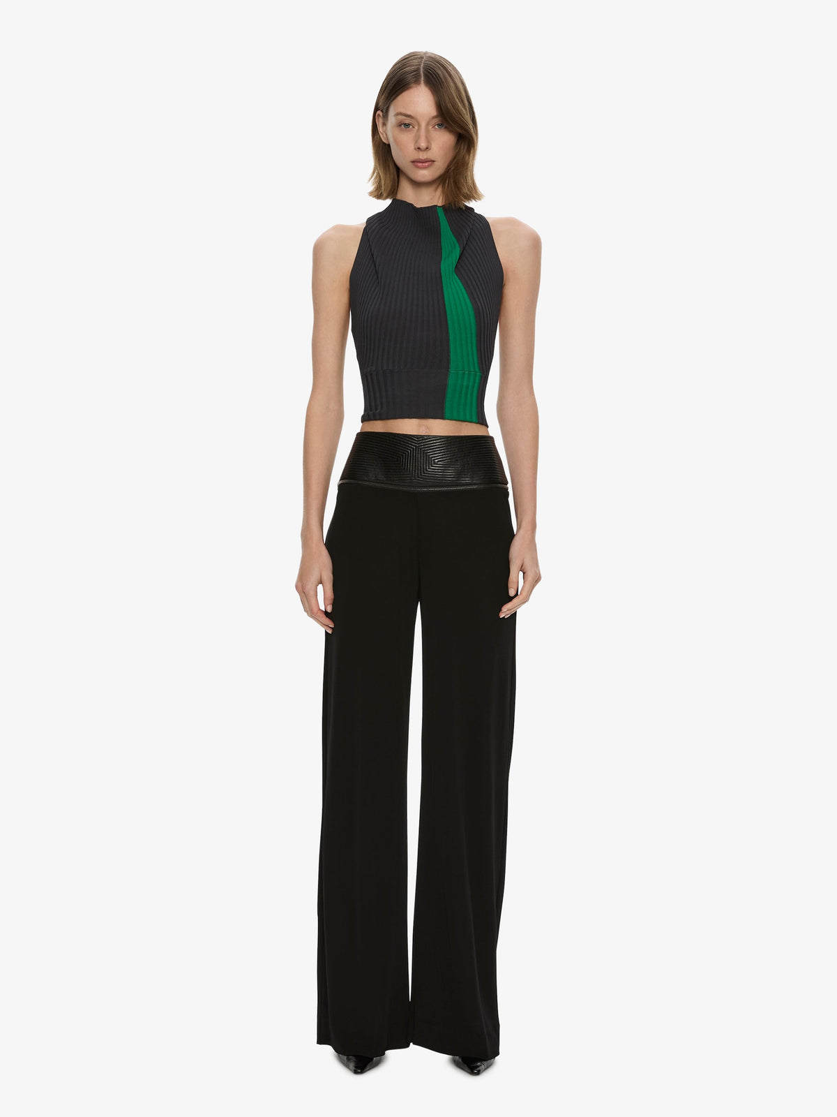 Image of a model wearing Pants. Product name - Auto Upholstered Leather Trouser in Black colour by brand - CHRISTOPHER ESBER