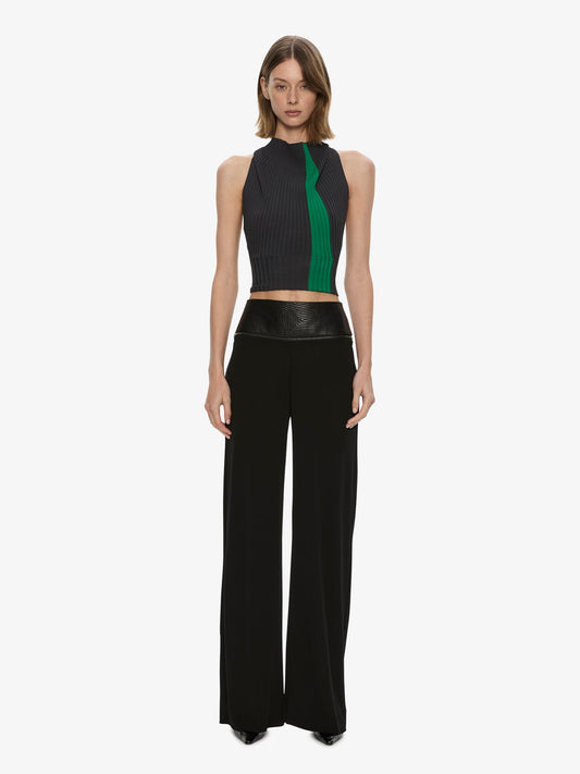 Image of a model wearing Pants. Product name - Auto Upholstered Leather Trouser in Black colour by brand - CHRISTOPHER ESBER
