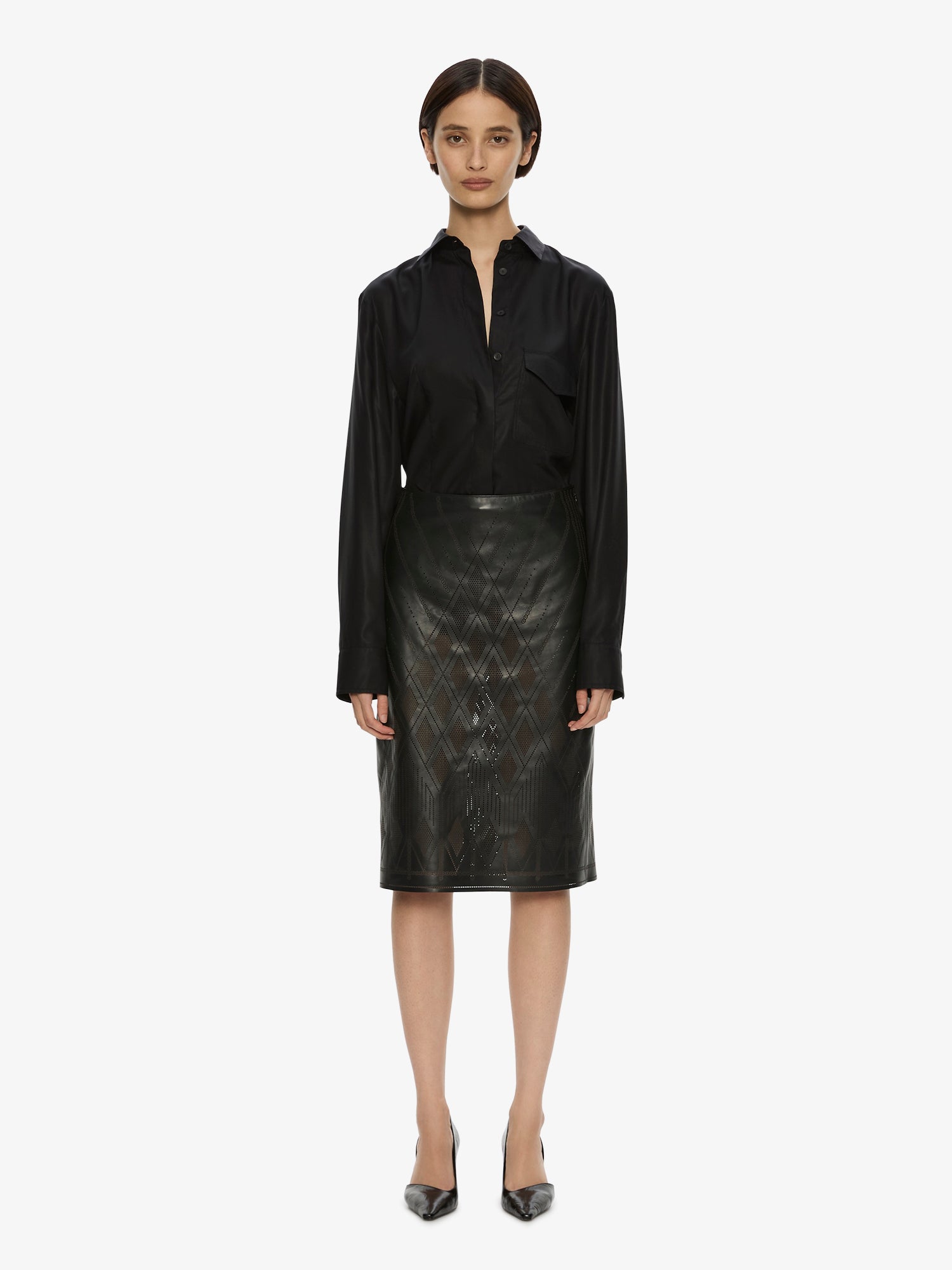 Image of a model wearing Skirts. Product name - Perforated Leather Skirt in Black colour by brand - CHRISTOPHER ESBER
