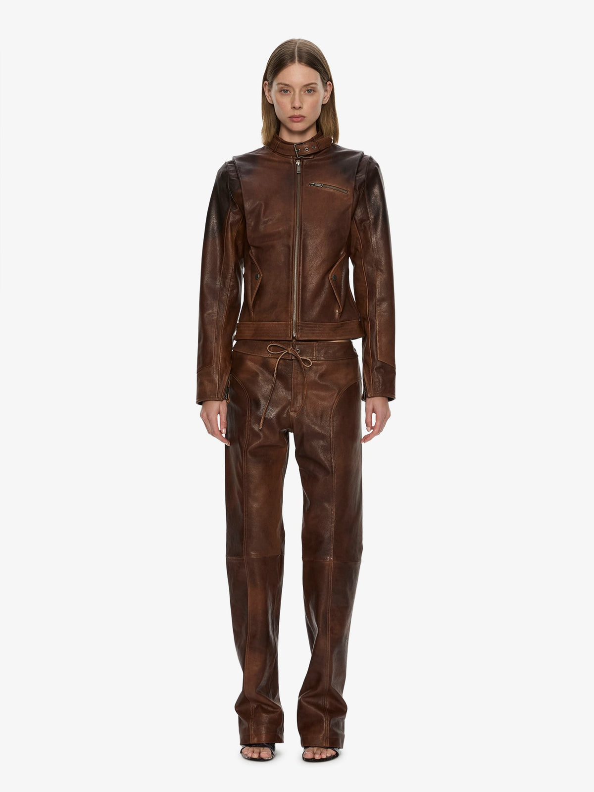 Image of a model wearing Pants. Product name - Alex Leather Pant in Brown colour by brand - CHRISTOPHER ESBER