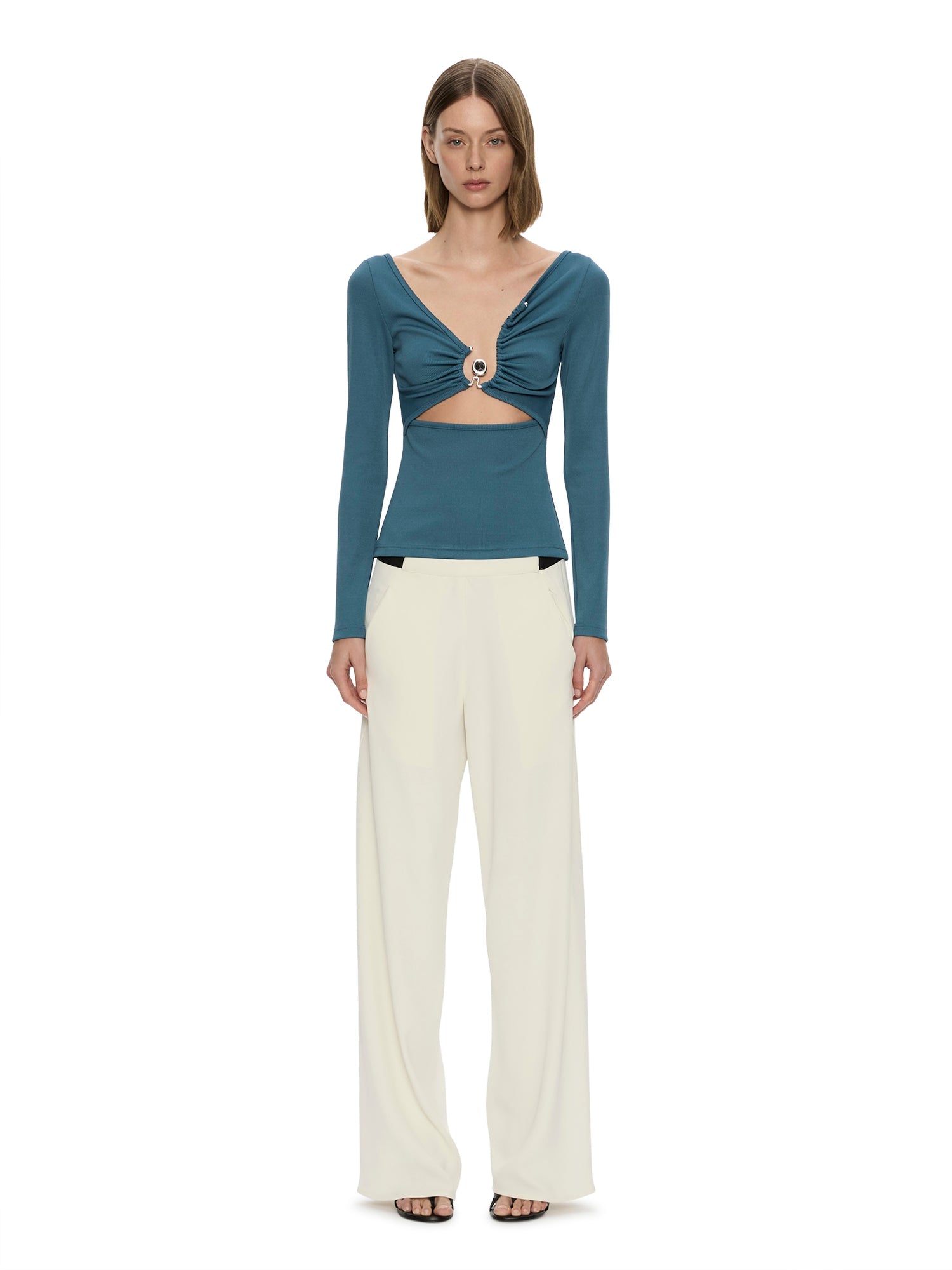 Image of a model wearing Pants. Product name - Bias Crepe Trouser in Cream colour by brand - CHRISTOPHER ESBER