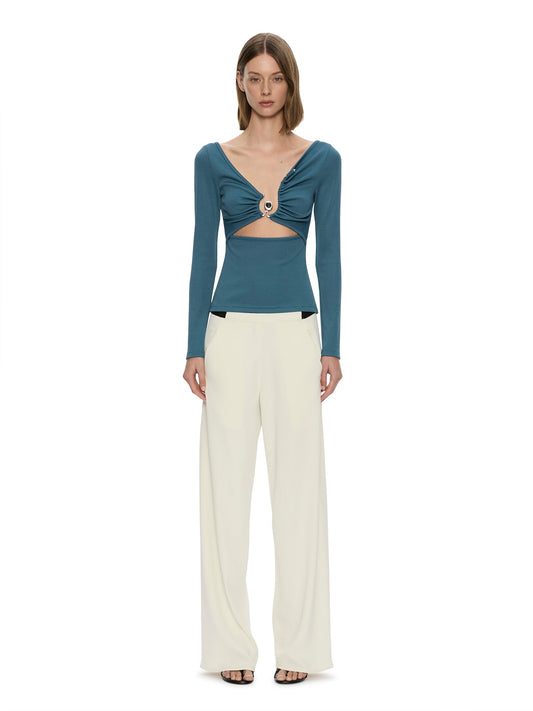 Image of a model wearing Pants. Product name - Bias Crepe Trouser in Cream colour by brand - CHRISTOPHER ESBER