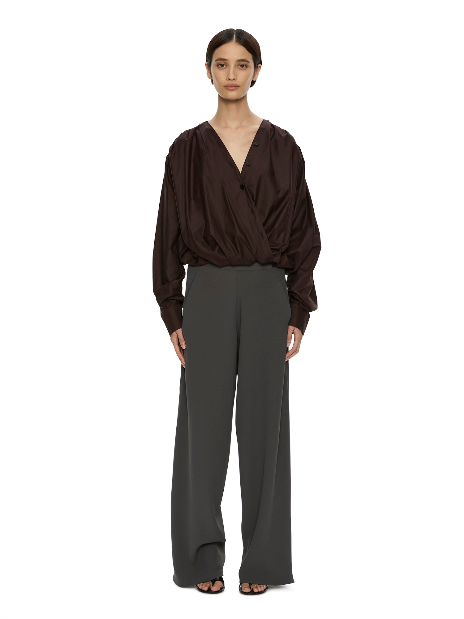Image of a model wearing Pants. Product name - Bias Crepe Trouser in Green colour by brand - CHRISTOPHER ESBER