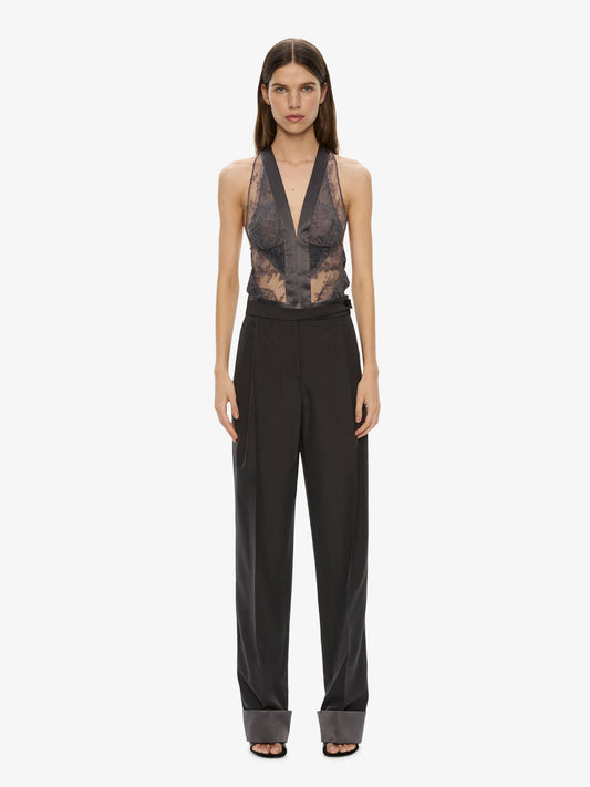 Image of a model wearing Pants. Product name - Rowan Sateen Cuffed Trouser in Smoke colour by brand - CHRISTOPHER ESBER