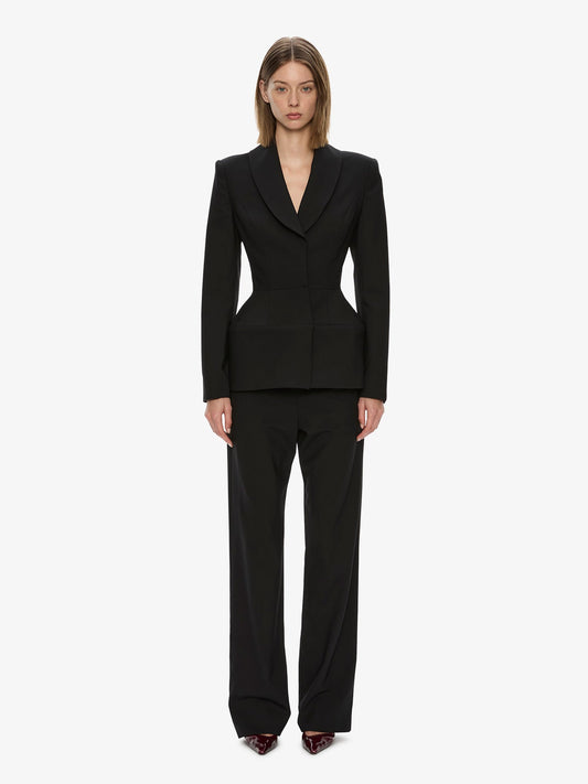 Image of a model wearing Pants. Product name - Lea Trouser in Black colour by brand - CHRISTOPHER ESBER