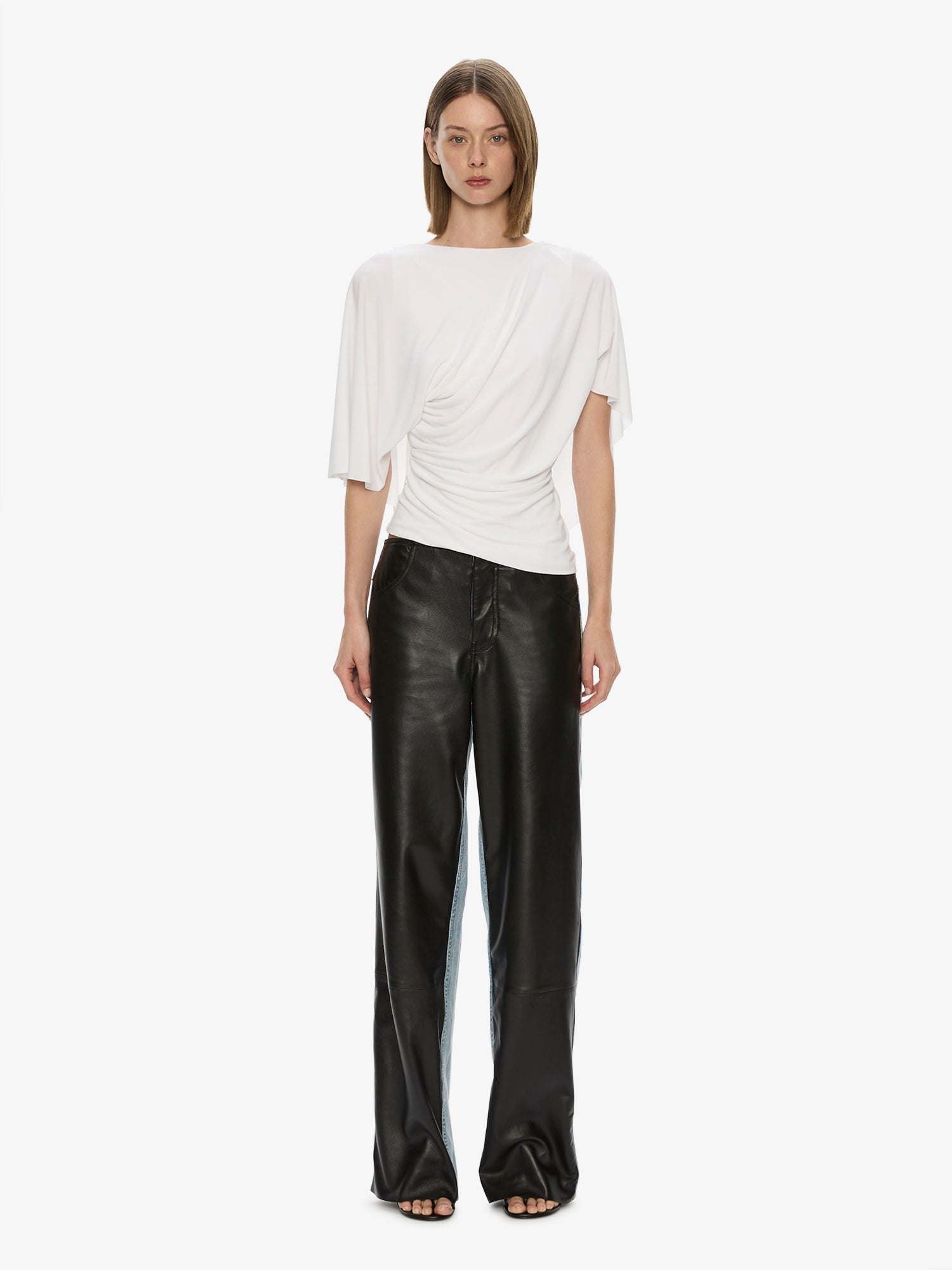 Image of a model wearing Pants. Product name - Troy Deconstruct Leather Jean in Black colour by brand - CHRISTOPHER ESBER