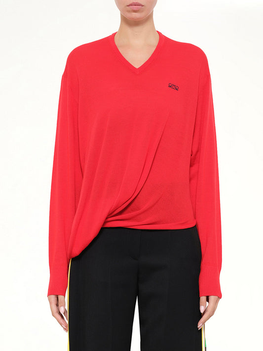 Image of a model wearing Outerwear. Product name - Draped Sweater in Red colour by brand - LOEWE