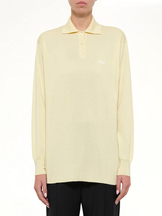 Image of a model wearing Tops. Product name - Polo Sweater in Yellow colour by brand - LOEWE