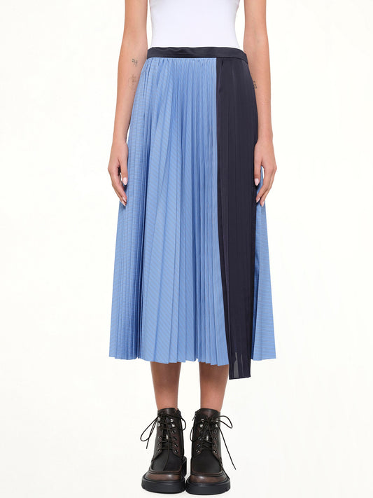 Image of a model wearing Skirts. Product name - Poplin Pleat Skirt in Blue colour by brand - SACAI