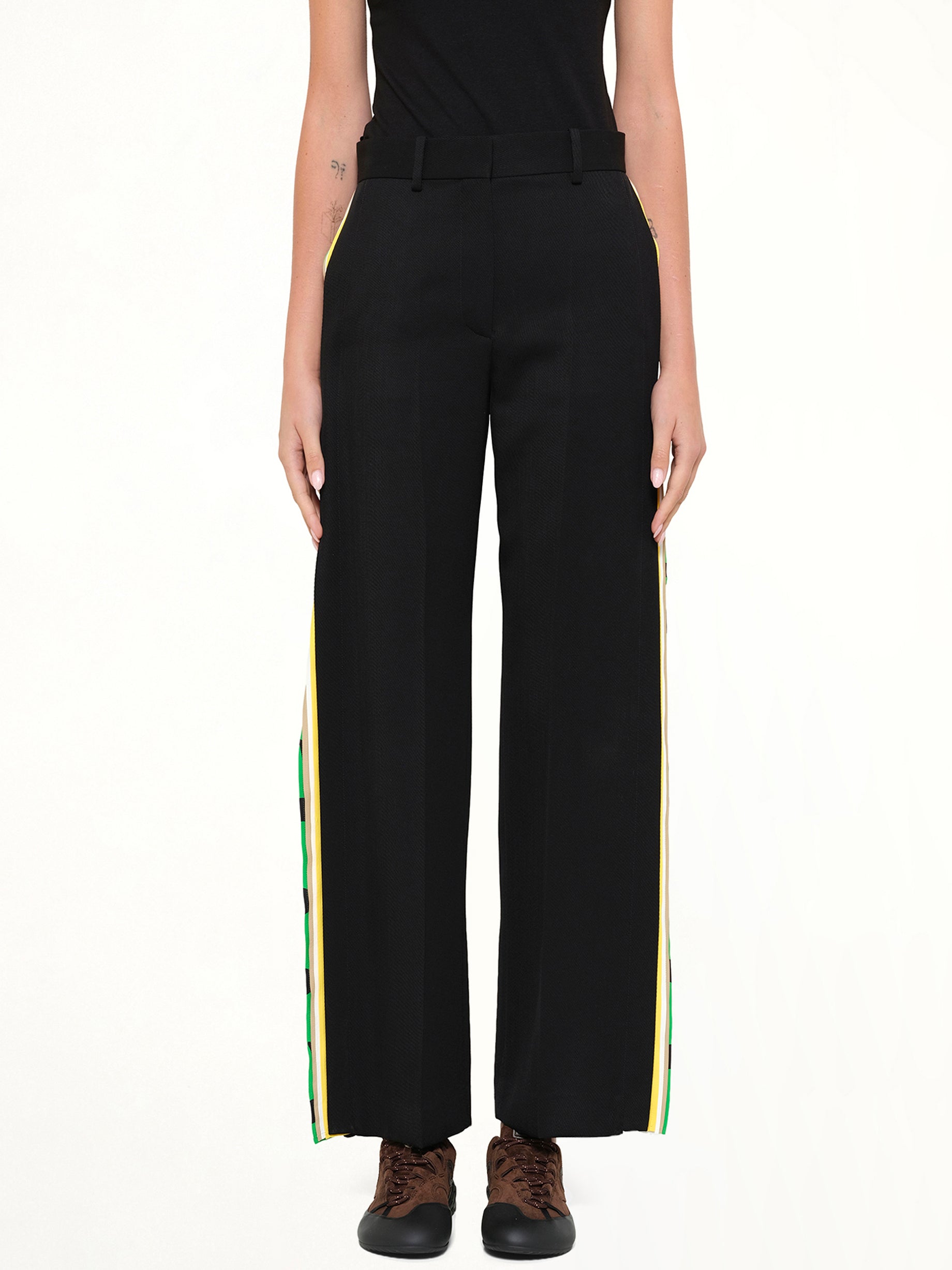 Image of a model wearing Pants. Product name - Trousers AF in Black colour by brand - LOEWE