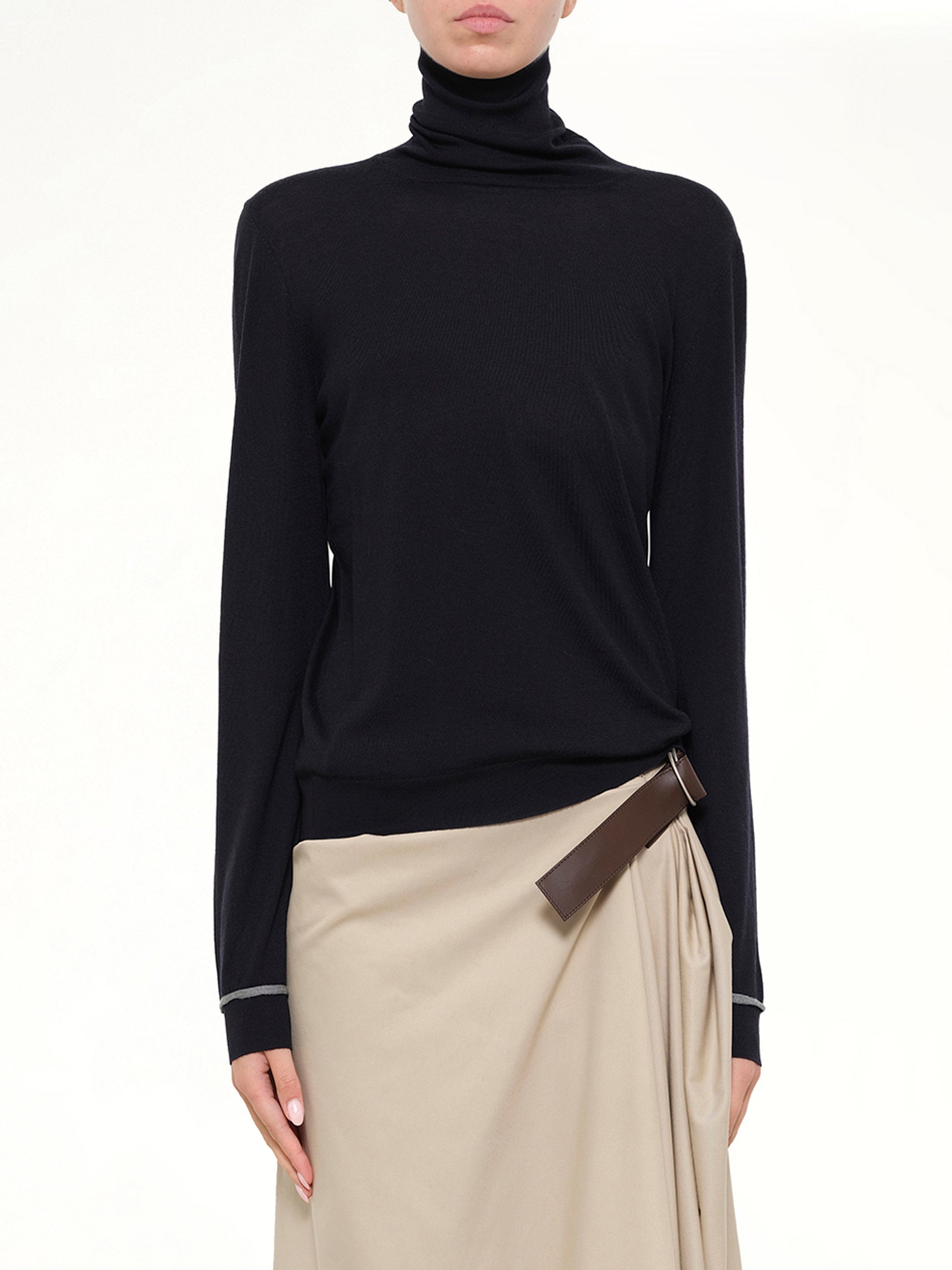 Image of a model wearing Tops. Product name - Turtleneck Sweater in Navy colour by brand - LOEWE