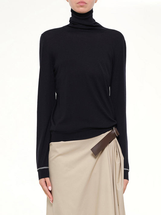 Image of a model wearing Tops. Product name - Turtleneck Sweater in Navy colour by brand - LOEWE