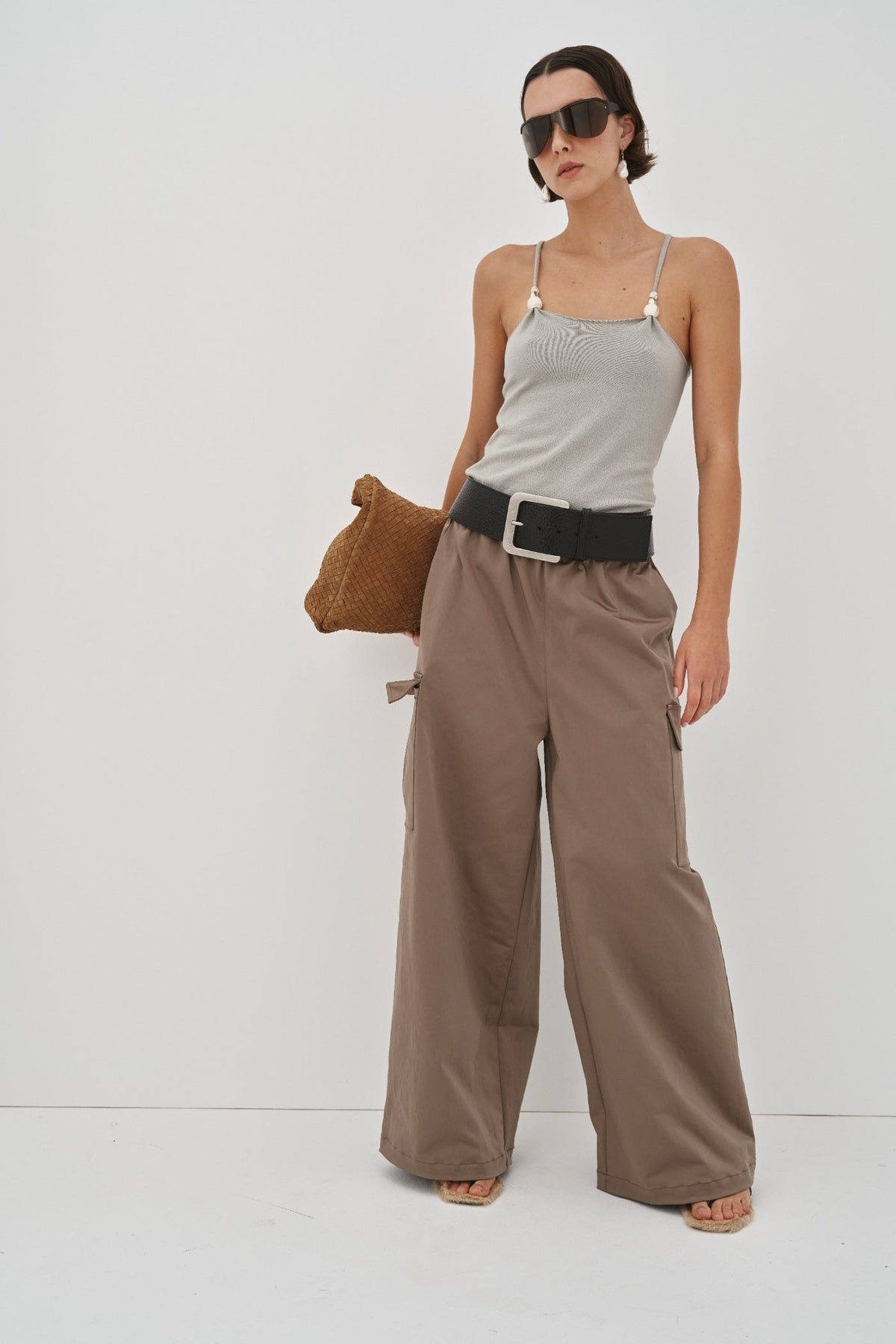 Image of a model wearing Tops. Product name - Remi Tank Preorder in Grey colour by brand - Blanca Studio