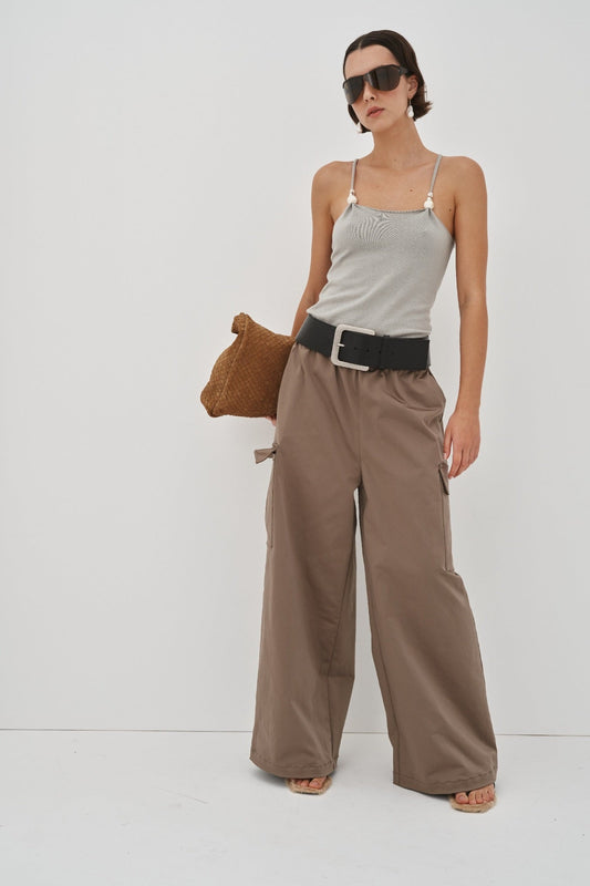 Image of a model wearing Pants. Product name - Lilou Cargos Preorder in Khaki colour by brand - Blanca Studio