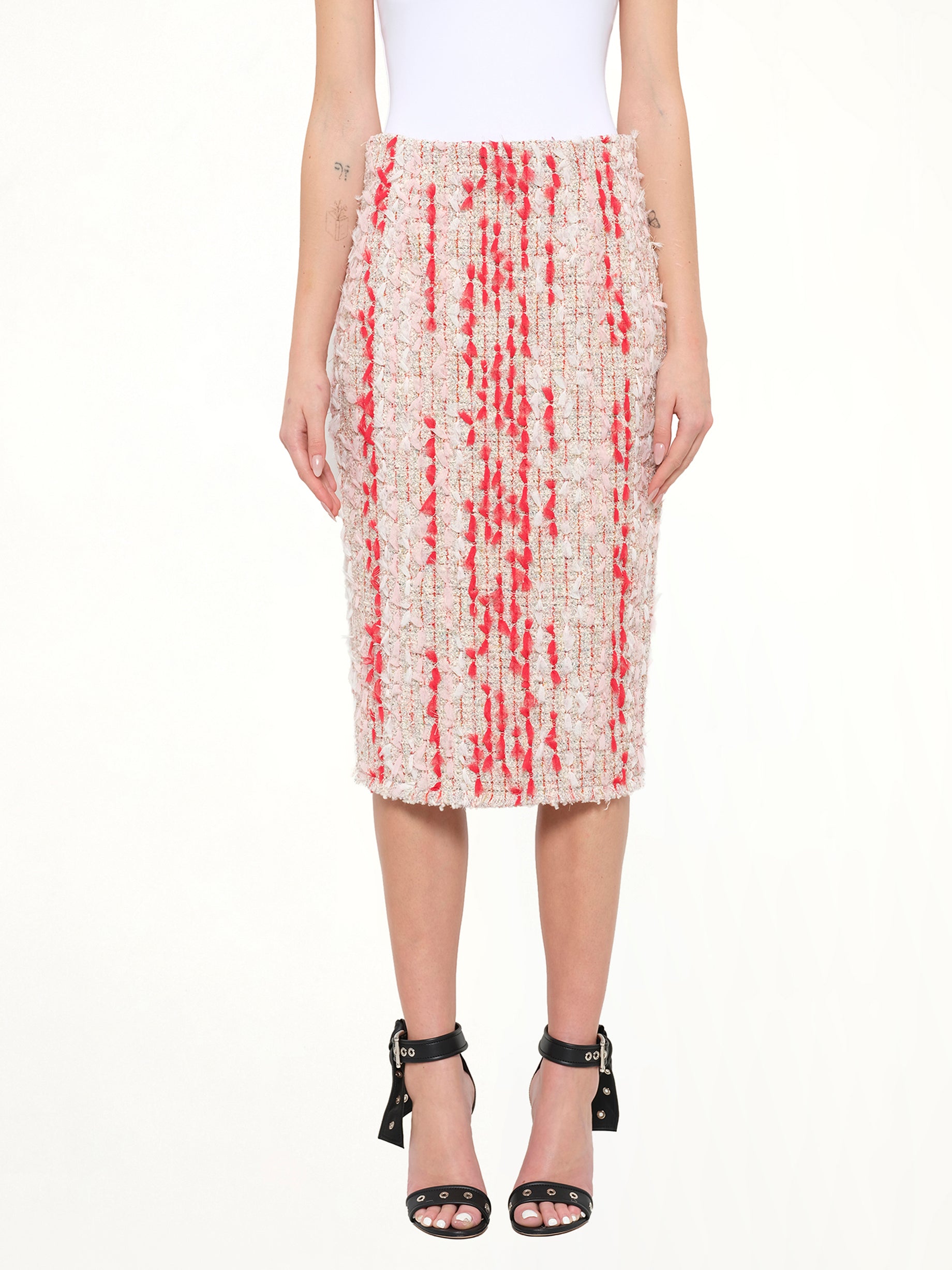 Image of a model wearing Skirts. Product name - Alexander McQueen Petal Tweed Skirt in Mix colour by brand - ALEXANDER MCQUEEN