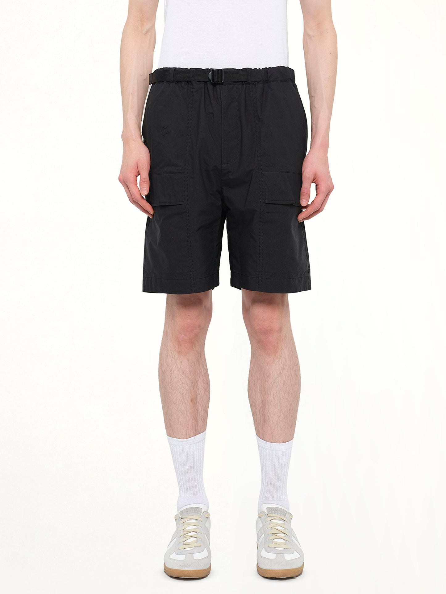 Image of a model wearing Shorts. Product name - Classic Shorts in Black colour by brand - JUUNJ