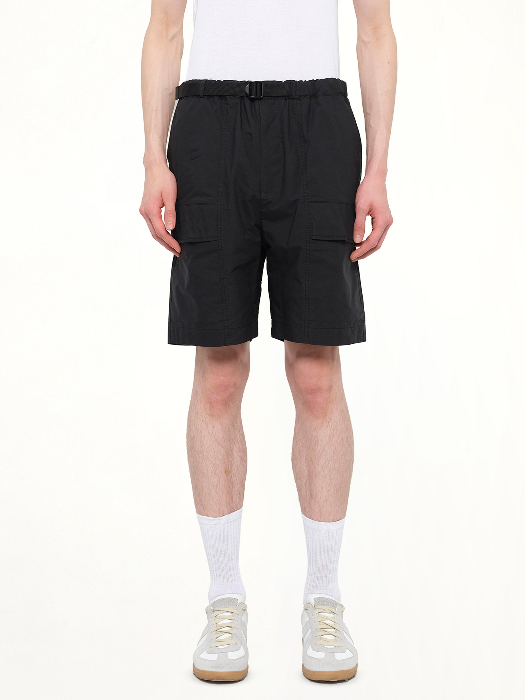 Image of a model wearing Shorts. Product name - Classic Shorts in Black colour by brand - JUUNJ