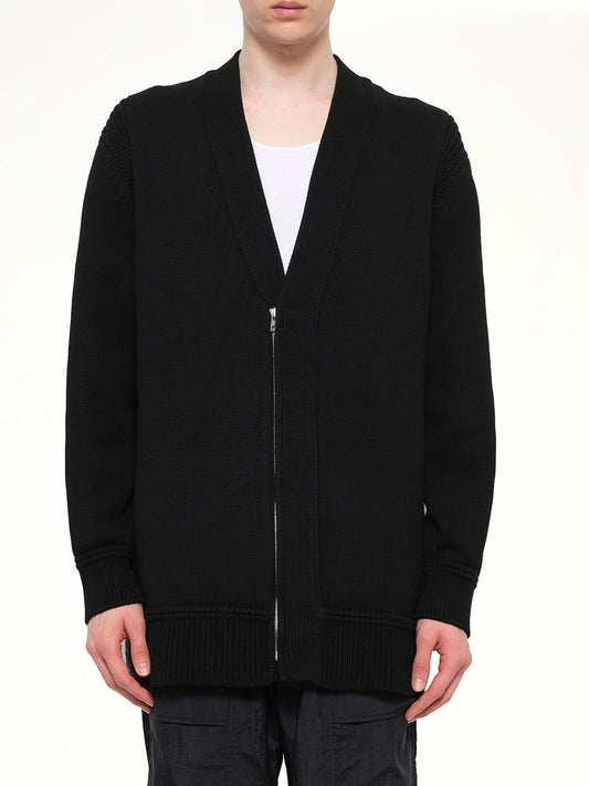 Image of a model wearing Outerwear. Product name - Coat in Black colour by brand - JUUNJ