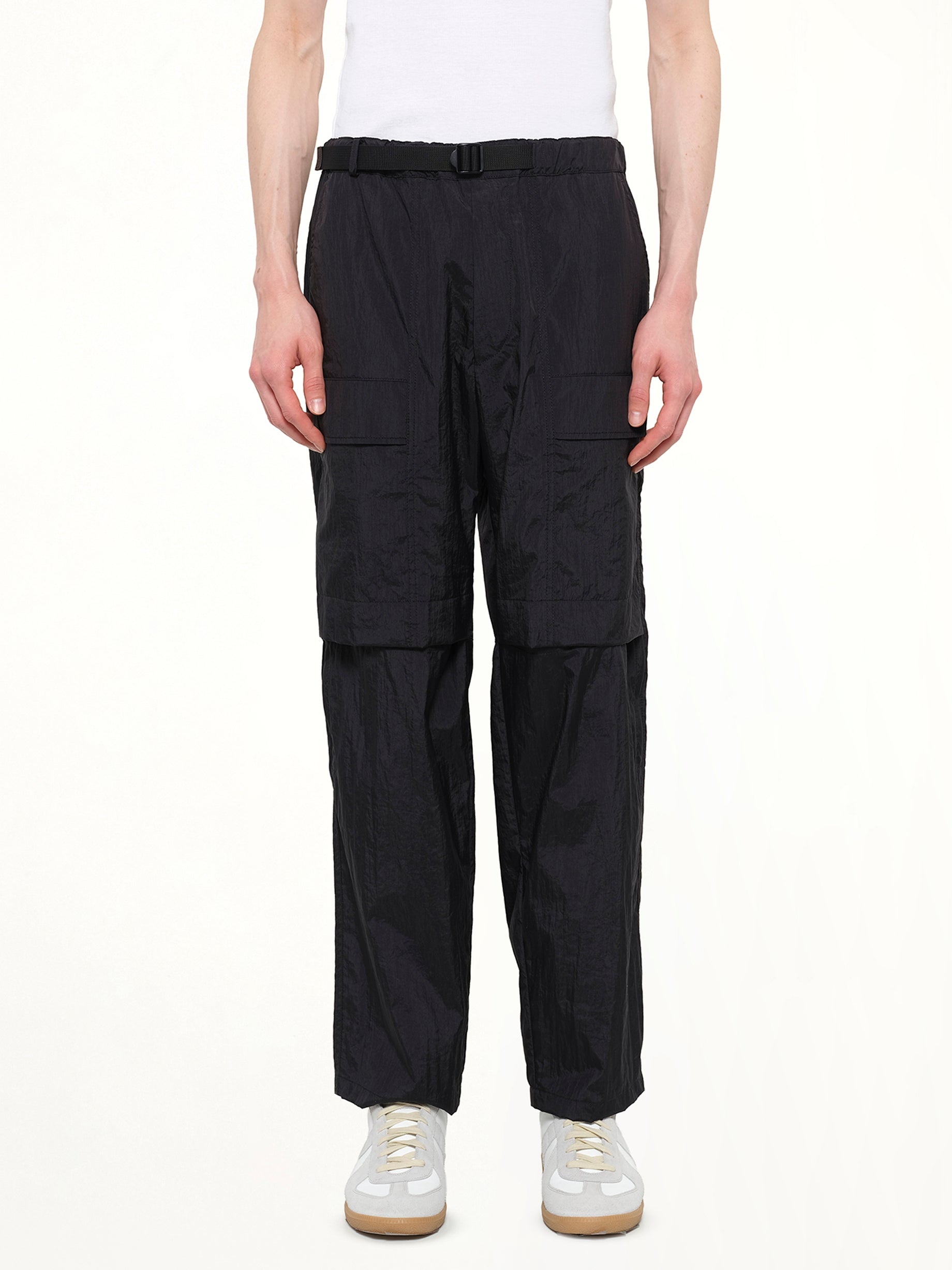 Image of a model wearing Pants. Product name - Detachable Zip Pant in Black colour by brand - JUUNJ