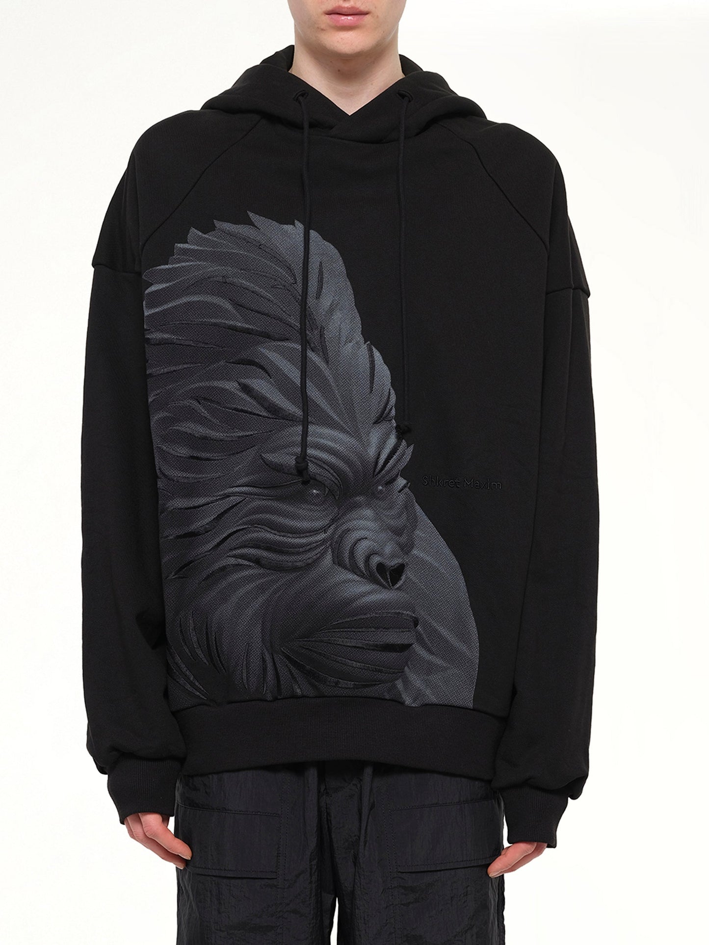 Image of a model wearing Outerwear. Product name - Gorilla Hoodie in Black colour by brand - JUUNJ