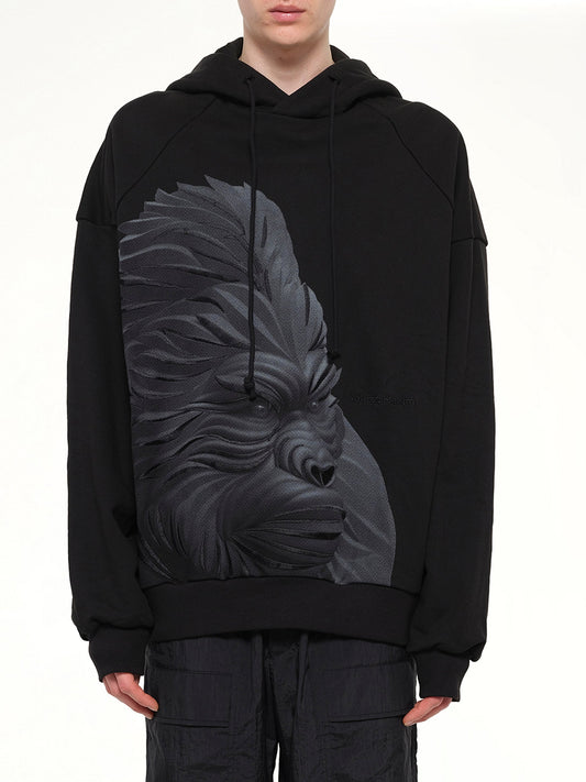 Image of a model wearing Outerwear. Product name - Gorilla Hoodie in Black colour by brand - JUUNJ