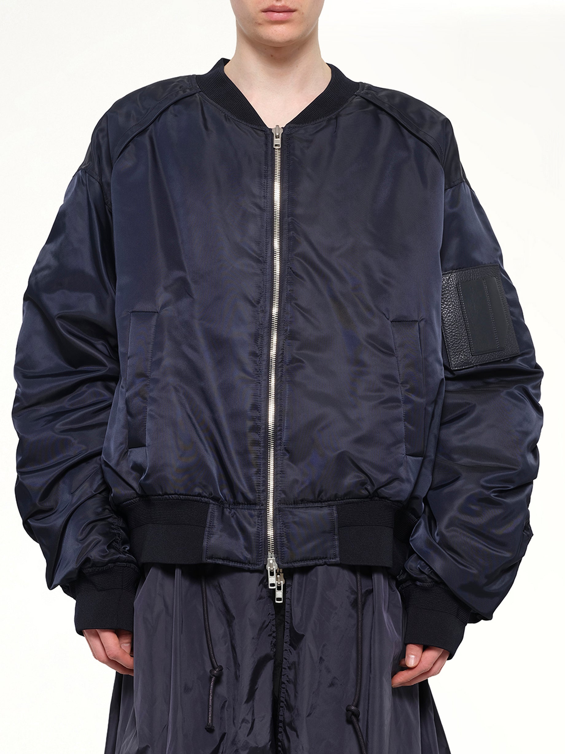 Image of a model wearing Outerwear. Product name - Juunj Coat in Navy colour by brand - JUUNJ