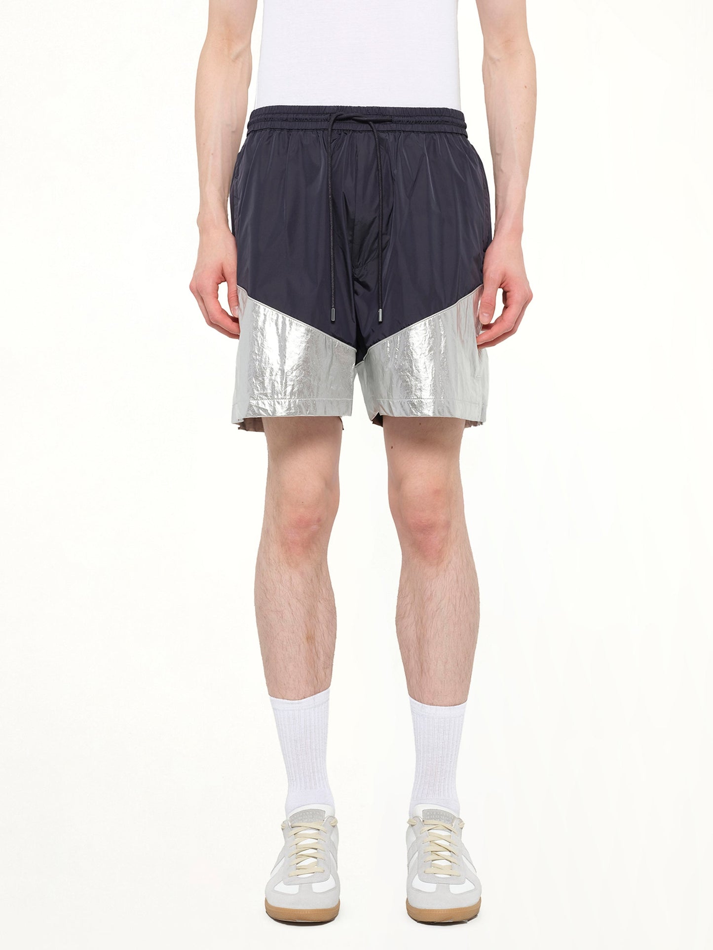 Image of a model wearing Shorts. Product name - Juunj Short in Navy colour by brand - JUUNJ