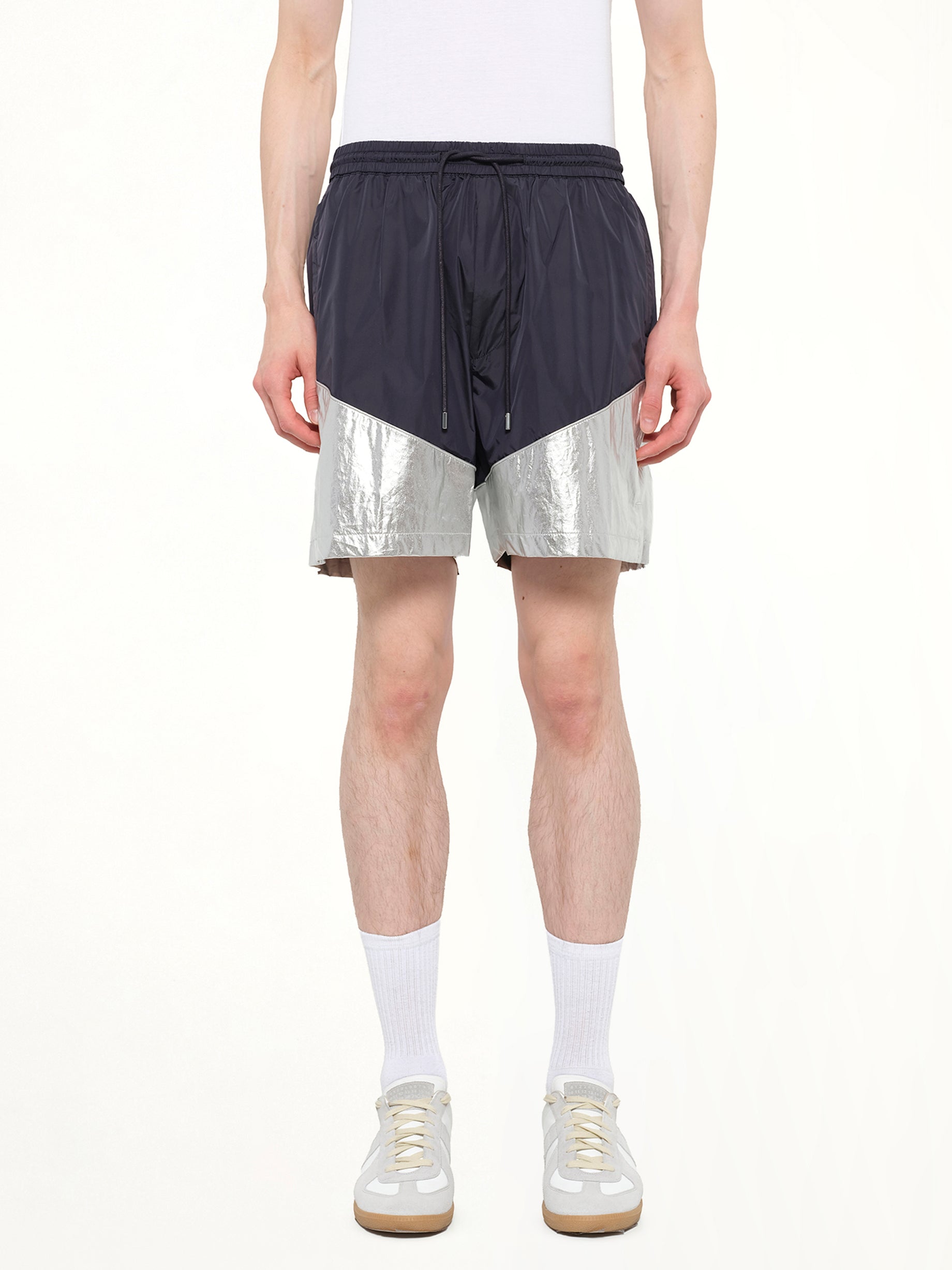 Image of a model wearing Shorts. Product name - Juunj Short in Navy colour by brand - JUUNJ