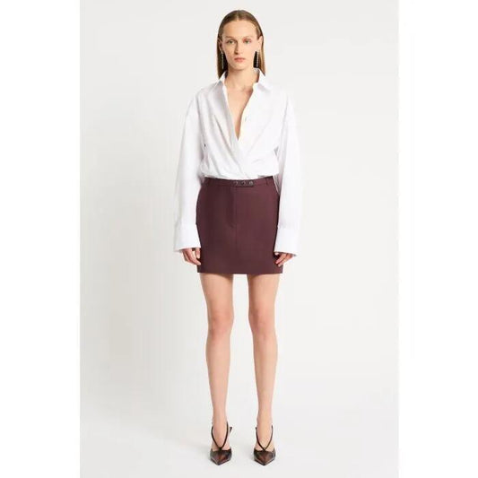 Image of a model wearing Skirts. Productname: Hindsight Mini Skirt in MERLOT colour by brand - sass and bide