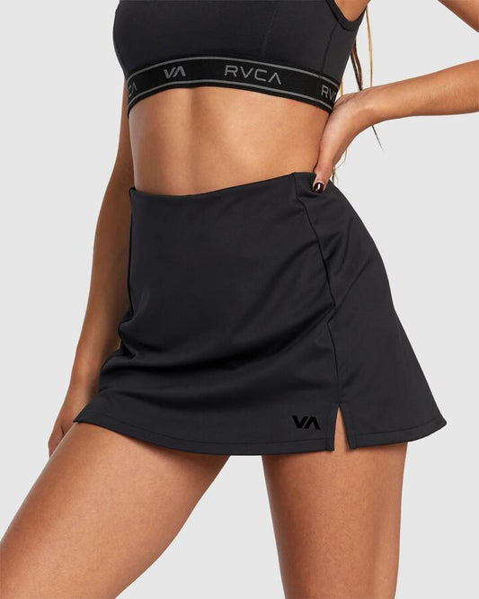 Image of a model wearing Skirts. Productname: RVCA - Womens Va Essential Tennis Skirt - Black - in Black colour by brand - RVCA