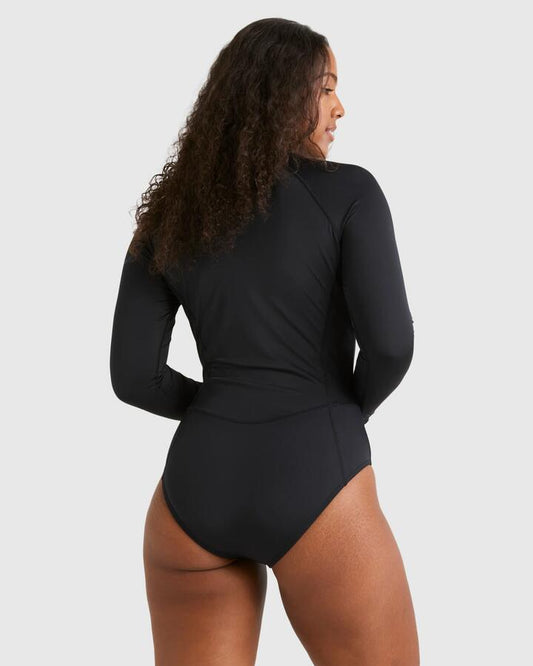 Image of a model wearing Tops. Productname: Billabong - Womens Serene Bodysuit Rash Vest - Black - in Black colour by brand - Billabong