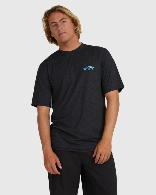 Image of a model wearing Tops. Productname: Billabong - Mens Shoreline Loose Fit Short Sleeve Rash Vest - Black Heather - in Black Heather colour by brand - Billabong