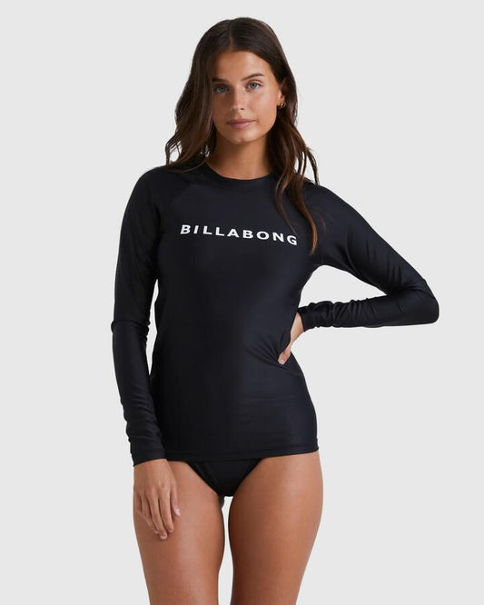Image of a model wearing Tops. Productname: Billabong - Womens Society Long Sleeve Rash Vest - Black - in Black colour by brand - Billabong