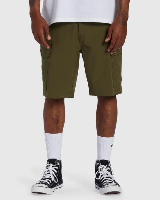 Image of a model wearing Shorts. Productname: Billabong - Mens Surftrek Transport Cargo Shorts - Military - in Military colour by brand - Billabong