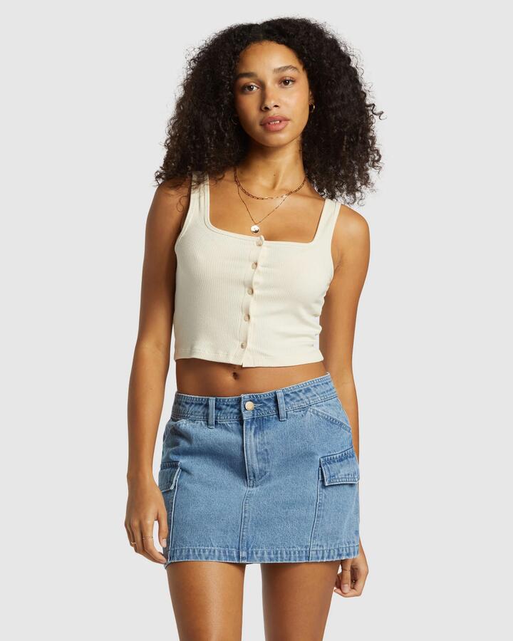 Image of a model wearing Skirts. Productname: Billabong - Womens Hilary Cargo Denim Skirt - Medium Blue Rinse - in Medium Blue Rinse colour by brand - Billabong